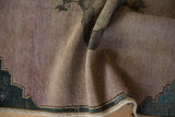 Vintage Oushak rug's textured, distressed pile with mauve abrash and dark teal corner.