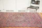 Intricately woven covered field design on a deep purple vintage Isfahan rug.