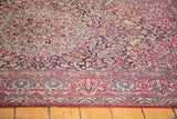 Finely woven red border and dense curvilinear floral pattern on the Isfahan rug.