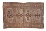 Distressed Kars carpet with four oversized geometric gul medallions, abrashed coffee brown and ivory tones.