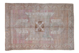 Vintage Distressed Oushak Carpet, shield medallion on abrashed pale raspberry, seafoam, camel field. 6' x 8'7