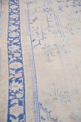 Vintage Distressed Oushak carpet, with worn cobalt blue border and foundation showing in ivory field.