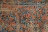 Worn antique Kurdish Hamadan rug: ruby red field, sky blue Herati, exposed foundation.