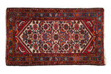 Vintage Borchalou rug with diamond medallion, Herati pattern, and serpent borders; red, ivory, blue.
