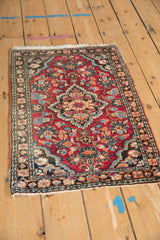 Vintage Lilihan rug showing cherry red field with interconnected palmettes and charcoal border.
