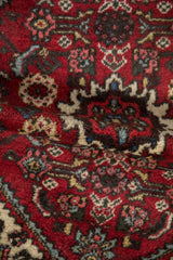 Textured cherry red Herati pattern of a vintage Borchalou rug, with powder blue accents.