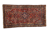 Vintage Persian Borchalou runner, scalloped medallion and branched plant pattern in brick red and blue.