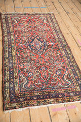 Vintage Persian Borchalou rug's dark blue main border, meandering vine palmette design, and ivory accents.