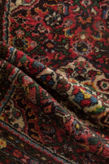 Textured pile of the vintage Dargezine rug, revealing colorful blossoms and floral sprays.