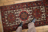 Overhead view showing the scale of a vintage Karaja runner with triple geometric medallions.