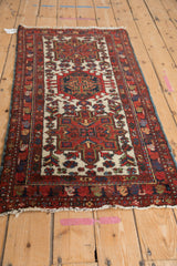 Vintage Karaja runner viewed from an angle, showing its geometric triple medallion design.
