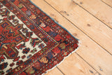 Intact polychromatic side cord selvage on the corner of a vintage Persian Karaja rug.