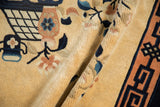 Lush pile texture with beige, cobalt, and apricot floral motifs on this vintage Peking rug.