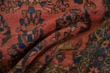 Textured pile of the vintage Lilihan rug, featuring dark coral, sapphire blue, gold, and brown vine motifs.