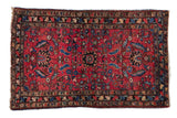 Antique Lilihan rug with serrated medallion, expressive florals, and vibrant gem-tone colors, 2'7