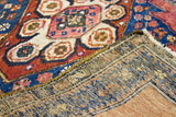 Vintage Persian Hamadan rug, detail of rose and indigo pile with tightly woven back.