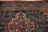 Vintage Persian Dargezine rug, Herati design, and pearl seed border in navy, red, and blue.