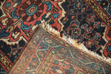 Vintage Dargezine rug's tightly woven foundation, natural fringe, and rich Herati pile.