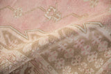 Vintage Distressed Mazlaghan rug pile texture with pale pink, fuchsia, and coffee brown tones.