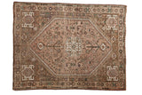 Vintage Qashqai square rug, central quatrefoil medallion, geometric field in dusty mauve, brown, and ivory.