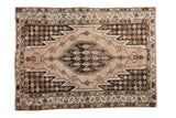 Vintage Mazlaghan rug featuring a sharp serrated medallion and geometric vinery, 4'5