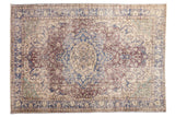 Distressed Sparta carpet features faded roundel medallion, floral vines, arabesques in blue, violet, ivory.