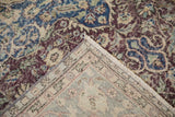 Vintage Distressed Sparta carpet corner, showing worn floral pile, fringed edge, and contrasting light reverse.