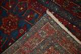 Vintage Karaja rug displaying its tightly hand-knotted foundation, vibrant pile, and fringe.