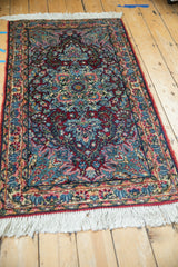 Vintage Kerman rug corner, showing newer applied fringe and minor edge loss.