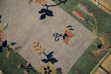Blush and blue floral motifs on speckled ivory pile of an antique Nichols Art Deco rug.