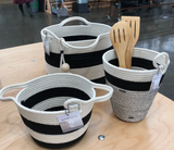 A collection of black and white striped cotton rope baskets shown in different sizes.