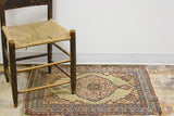 Late 19th century Kerman rug mat with low pile, khaki field, maroon, navy medallion.