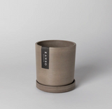 4 inch Recycled Planter Beachwood, cylindrical, earthy brown composite texture with saucer.
