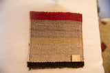 Vintage Aguayo weaving fragment with striped red, grey, tan, black colors and 017 tag.