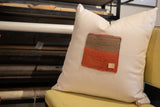Textured brown and terracotta Aguayo weaving on a vintage limited edition pillow.
