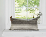 Dark gray and natural striped linen lumbar pillow with cream leather pull.