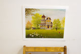 Whimsical K Chin lithograph depicting ornate yellow house, vivid green lawn, and red boy.