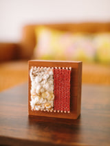 Loom Block Art #603 showcasing hand-woven natural fibers, chunky cream and tight rust textures on cherry wood.