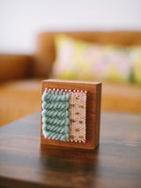 Loom Block Art #606, hand woven mint green and cream fibers with brass nails on cherry wood.
