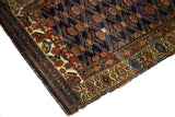 Aged end of antique Kurdish runner, royal blue ground, rust tribal medallions, visible wear.