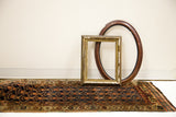 Visible wear on ends of late 19th century Kurdish tribal runner's rich navy and earth-toned pattern.