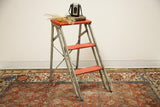 Vintage Industrial Red and Silver Step Stool with distressed metal frame and wood steps.