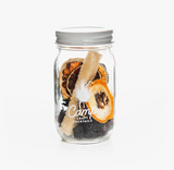 Camp Craft Cocktail Cherry Limeade kit in a glass jar with dried fruit and sugar stick.