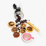 Dried lime and hibiscus pieces, sugar stick, and Cherry Limeade kit label.
