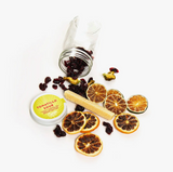 Camp Craft Tomatillo Sour cocktail kit: dried cranberries, citrus, tomatillos, sugar stick.
