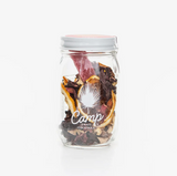 Camp Craft Cocktail Hibiscus Ginger Lemon in a jar with dried ingredients.
