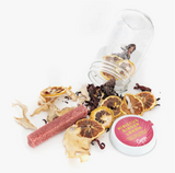 Hibiscus Ginger Lemon cocktail kit's dried ingredients and labeled jar lid.