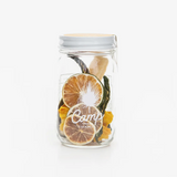 Dried pineapple, lime, and jalapeño mix in a Camp Craft Cocktail jar.