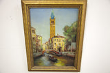 Angled view of the vintage B. Dressel Italy painting, framed in textured gold.