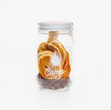 Camp Craft Cocktail Cranberry Martini Mix in clear glass jar with dried orange and cranberries.